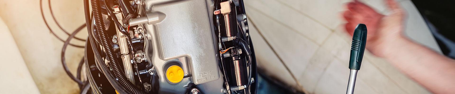 Marine Mechanic working on a outboard motor