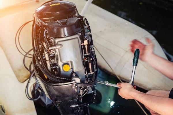 Marine Mechanic working on a outboard motor